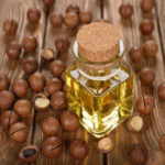Macadamia nut oil on a brown background
