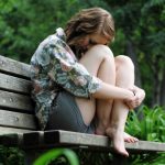 www.GetBg.net_Girls_Sad_girl_sitting_on_the_bench_100713_